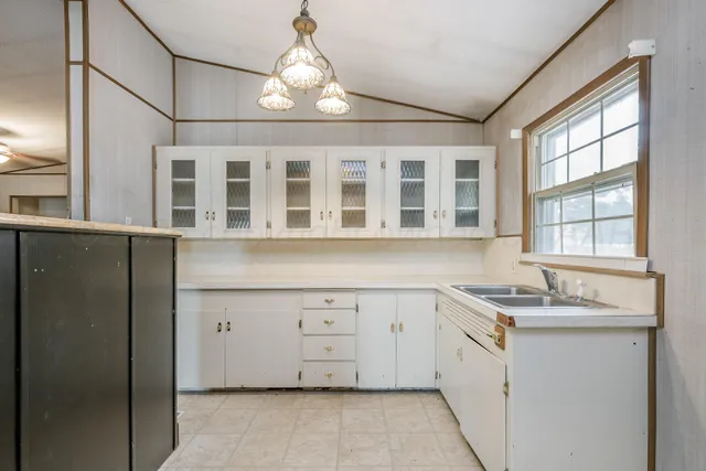 a bathroom with a sink and a window