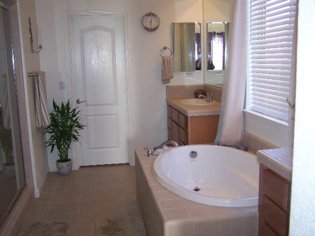 880 Sienna Reno, NV 89512 - Photo 7 of 9 a bathroom with a bathtub and a sink