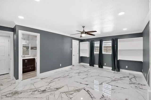 a view of a bedroom with a large bed and chandelier
