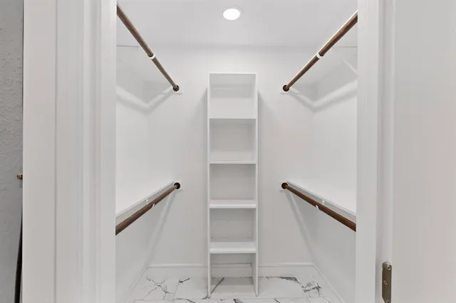 a view of staircase with white walls