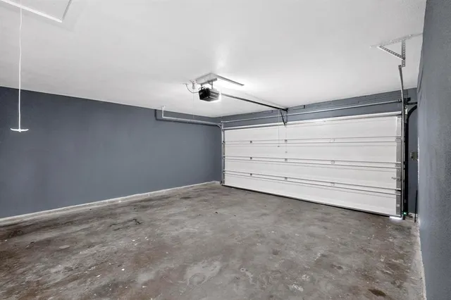 a view of an empty room with wooden walls