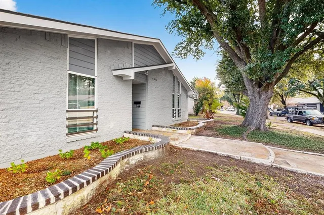 a house view with a backyard space