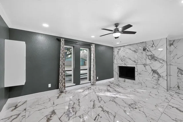 a large bedroom with a bed and a chandelier