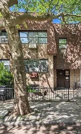 a front view of a house with parking