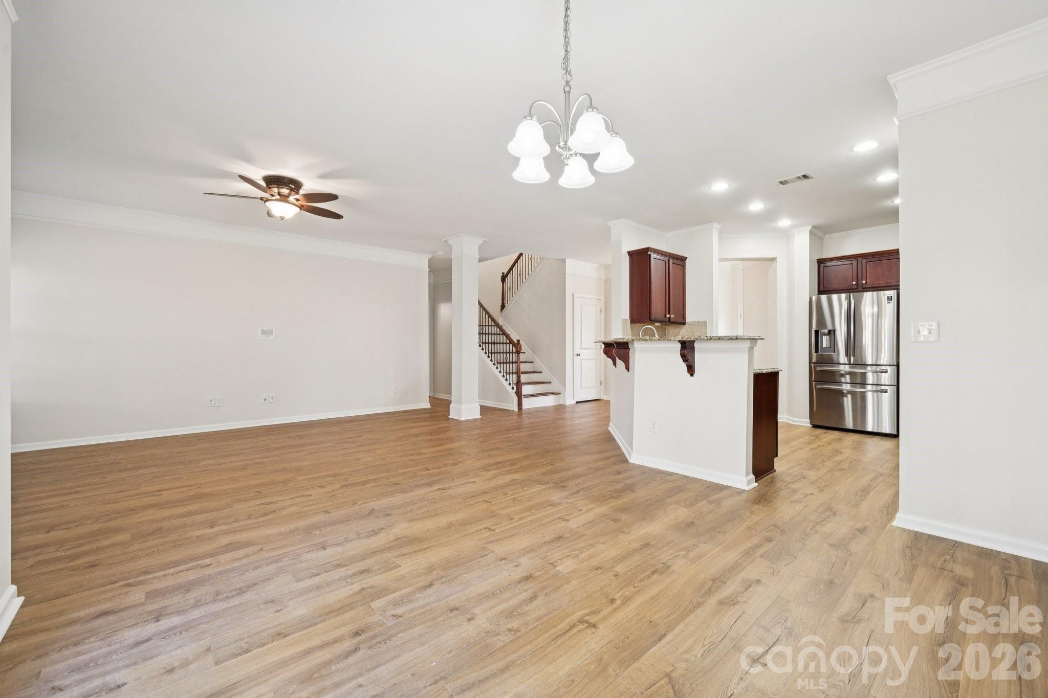 2015 Terrapin Street Indian Trail, NC 28079 - Photo 12 of 30 a view of a kitchen with wooden floor and a chandelier
