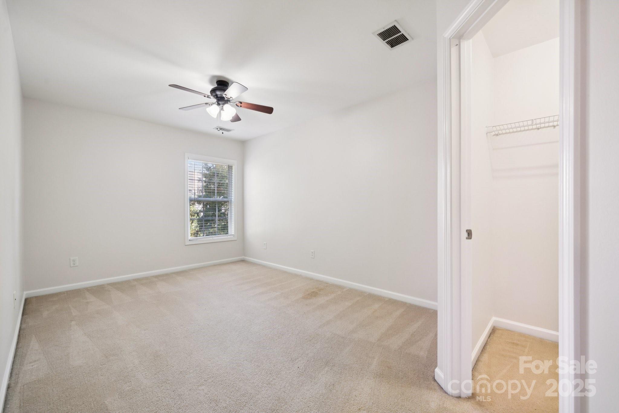 2015 Terrapin Street Indian Trail, NC 28079 - Photo 20 of 28 an empty room with windows and fan