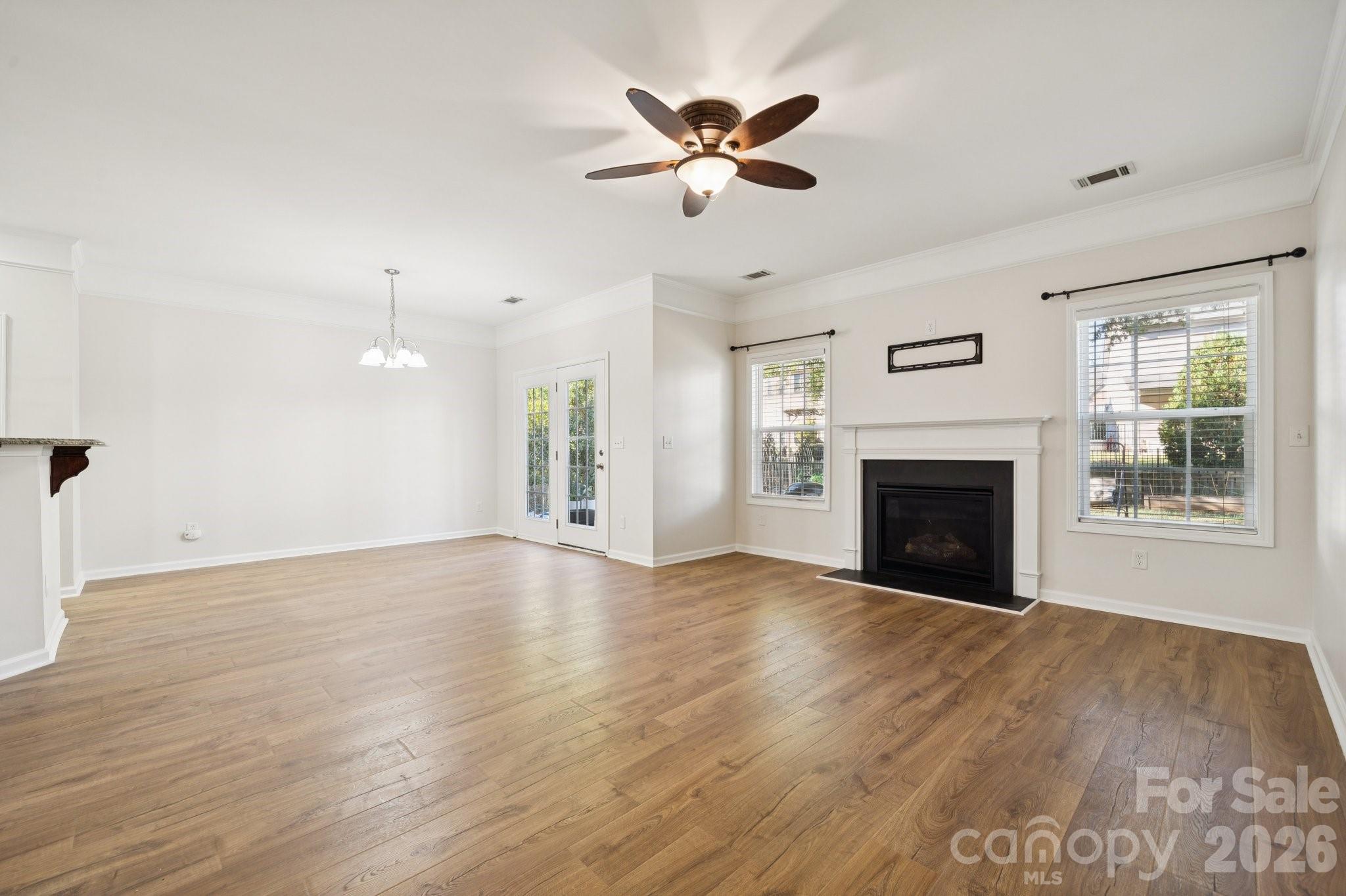 2015 Terrapin Street Indian Trail, NC 28079 - Photo 7 of 30 a view of empty room with wooden floor and fireplace