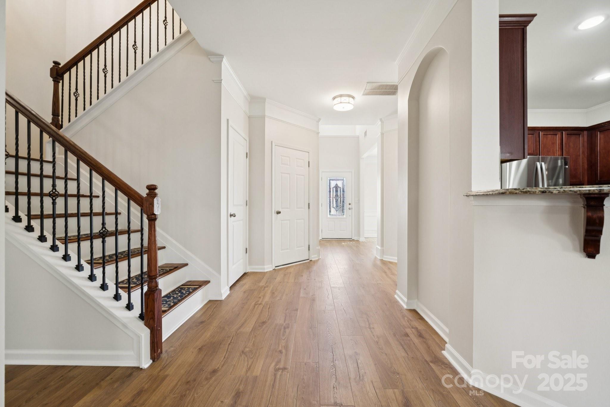 2015 Terrapin Street Indian Trail, NC 28079 - Photo 9 of 31 a view of a hallway with wooden floor and staircase