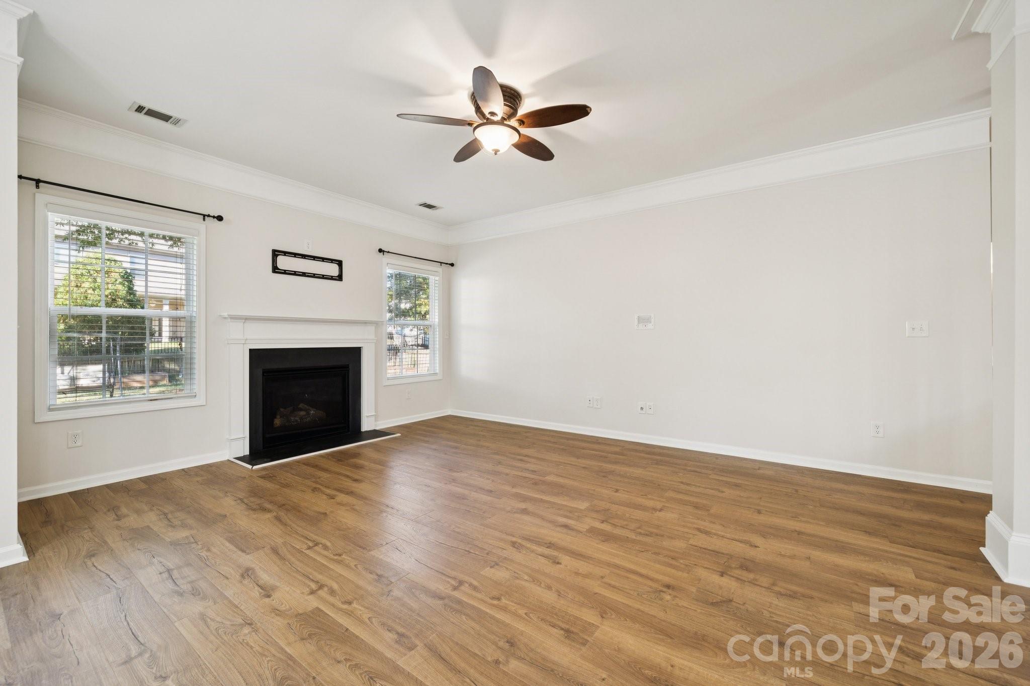 2015 Terrapin Street Indian Trail, NC 28079 - Photo 9 of 30 an empty room with windows and fireplace
