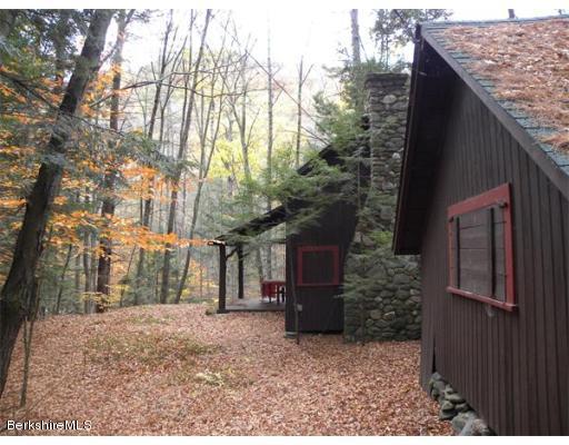 111 Rowe Road Charlemont, MA 01339 - Photo 1 of 17 a backyard of a house with lots of green space