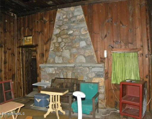 111 Rowe Road Charlemont, MA 01339 - Photo 6 of 17 a outdoor living space with patio furniture and a fireplace