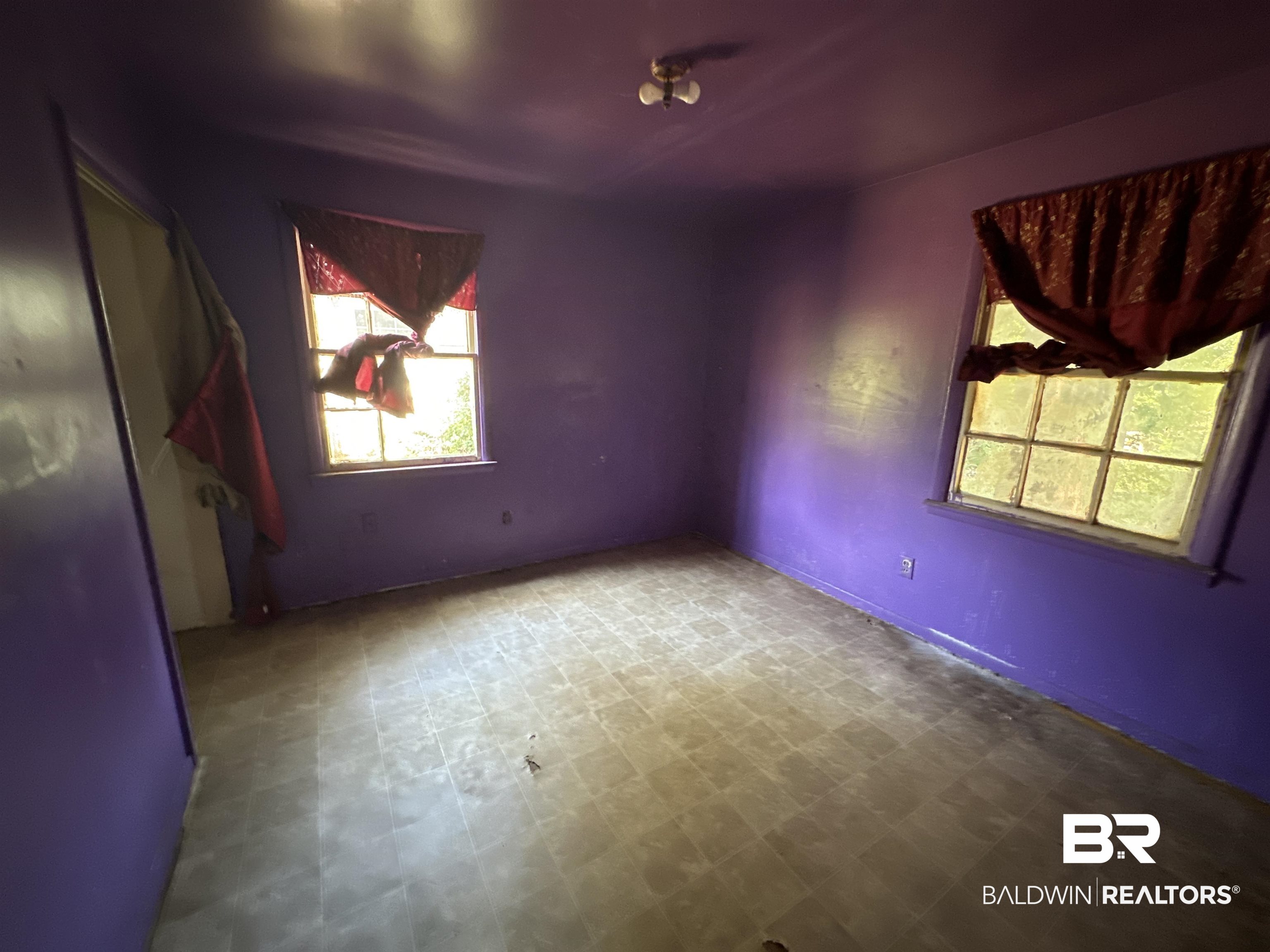 58 Chieftain Way Mobile, AL 36611 - Photo 8 of 12 Empty room with tile patterned floors
