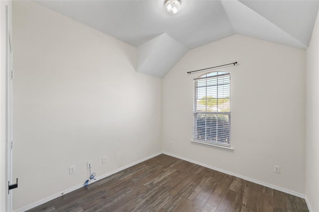 2124 Hickory Ridge Drive Mesquite, TX 75181 - Photo 10 of 16 an empty room with wooden floor and windows