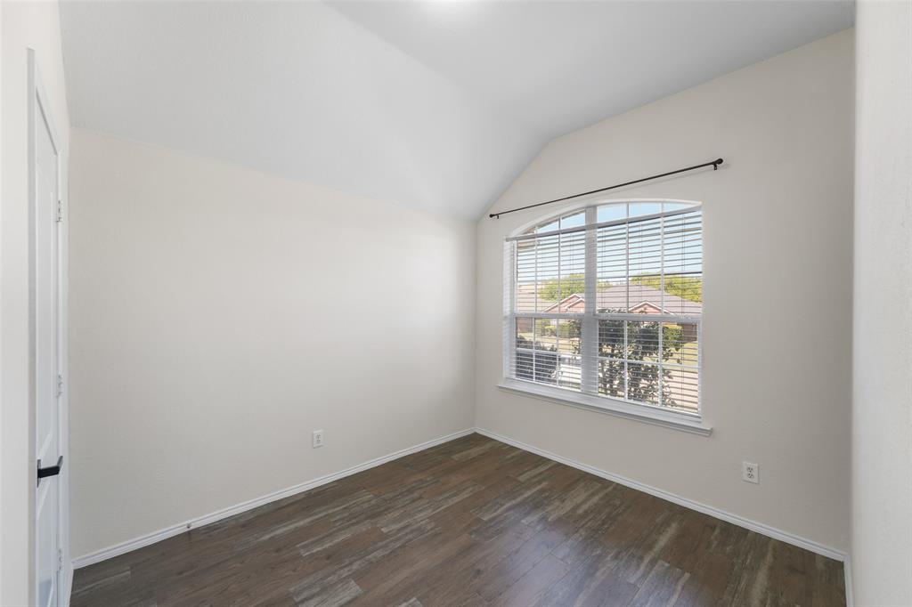 2124 Hickory Ridge Drive Mesquite, TX 75181 - Photo 13 of 16 an empty room with wooden floor and windows