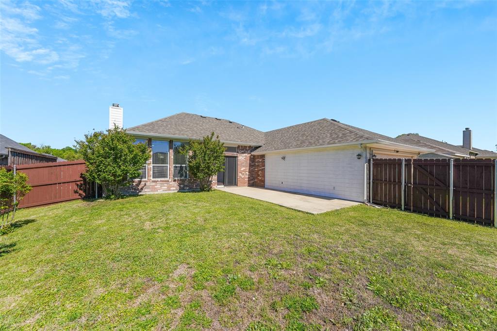 2124 Hickory Ridge Drive Mesquite, TX 75181 - Photo 15 of 16 a front view of a house with yard and garage
