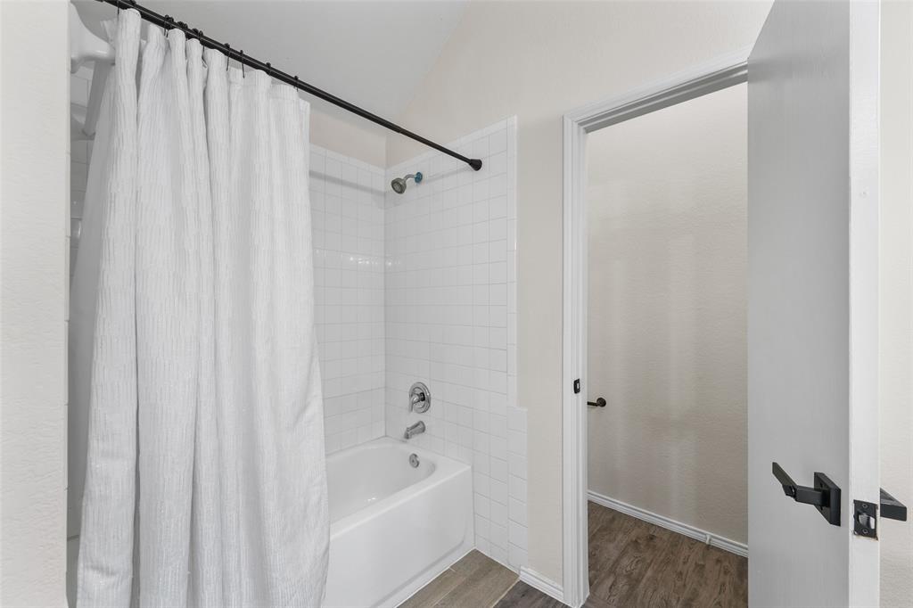2124 Hickory Ridge Drive Mesquite, TX 75181 - Photo 9 of 16 a bathroom with a bathtub and a shower
