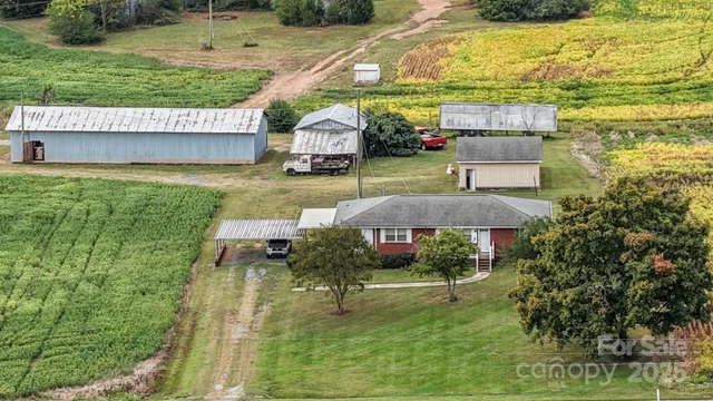 a view of a swimming pool with a yard