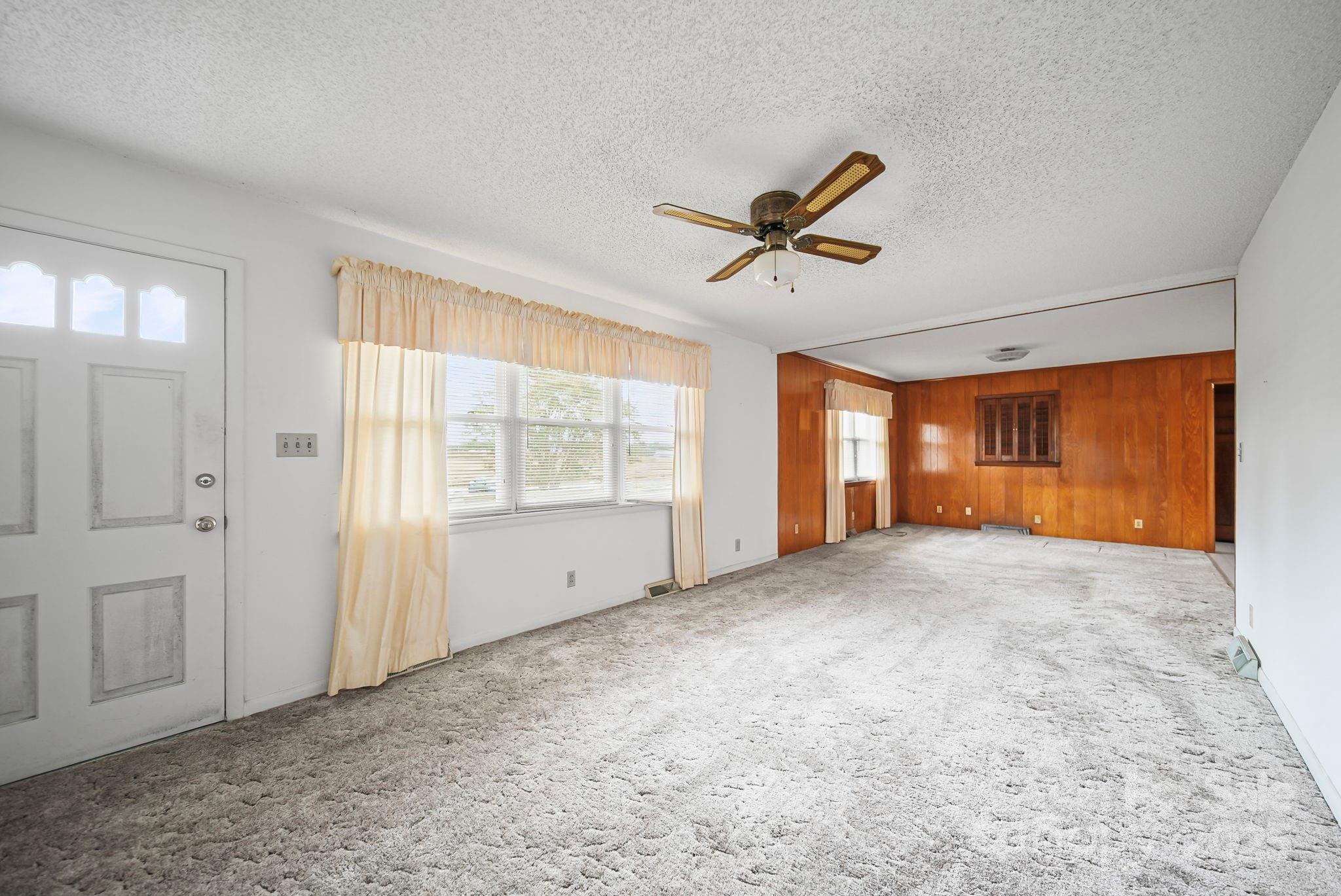 3710 Camden Road Marshville, NC 28103 - Photo 16 of 38 a view of a livingroom with a ceiling fan and window