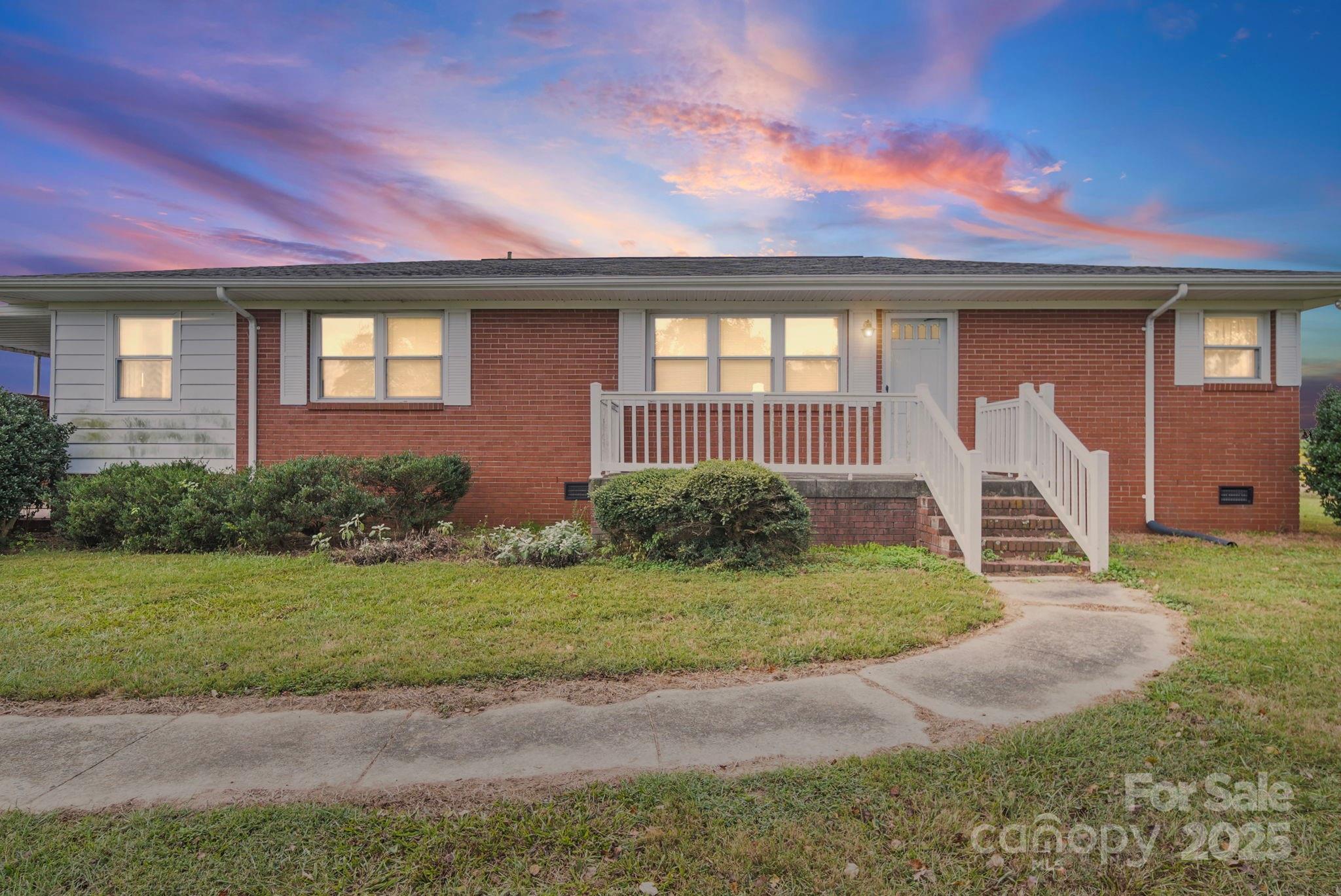 3710 Camden Road Marshville, NC 28103 - Photo 2 of 38 a front view of a house with a yard