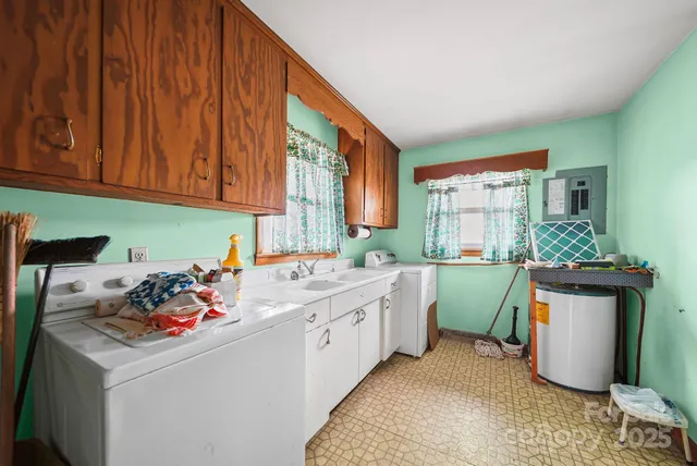 a bedroom with a large bed and a flat tv screen on dresser