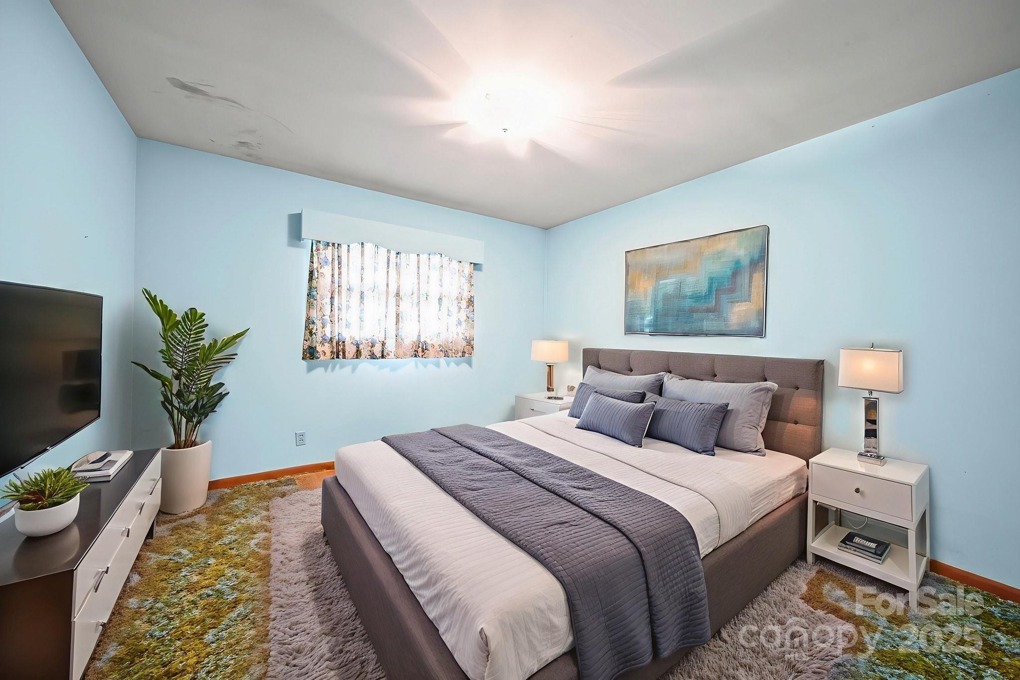 3710 Camden Road Marshville, NC 28103 - Photo 24 of 38 a bedroom with bed and a flat screen tv