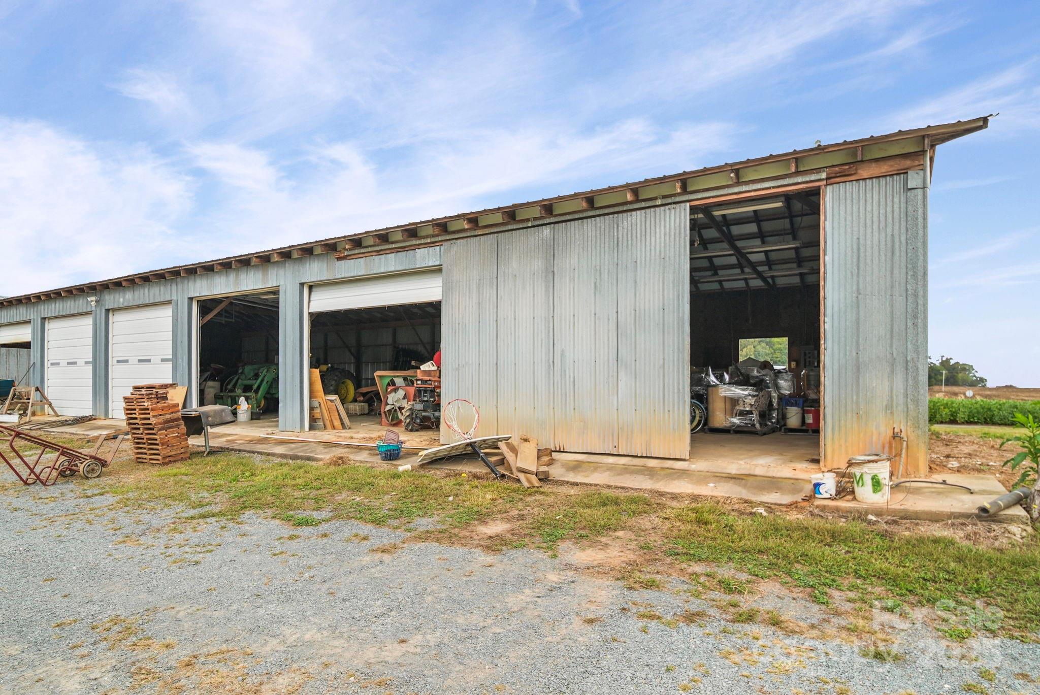 3710 Camden Road Marshville, NC 28103 - Photo 31 of 38 a front view of a house with basket ball court and glass windows