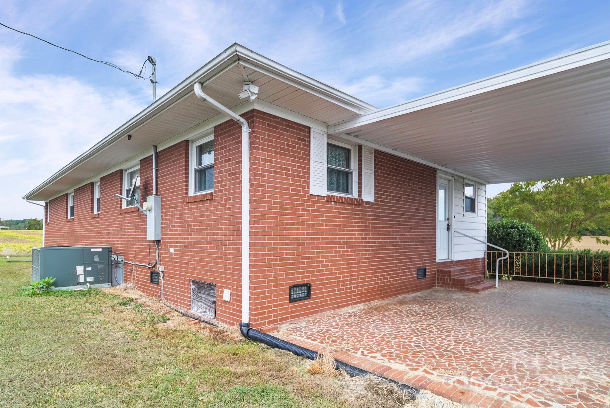 3710 Camden Road Marshville, NC 28103 - Photo 5 of 38 a front view of a house with garage