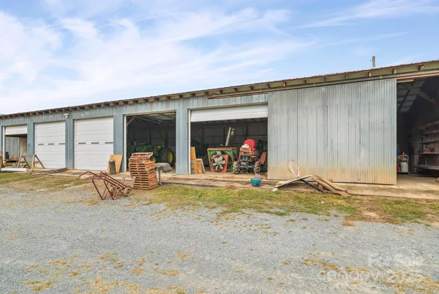 a view of a house with backyard porch and furniture