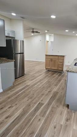 a view of a kitchen with microwave and stove