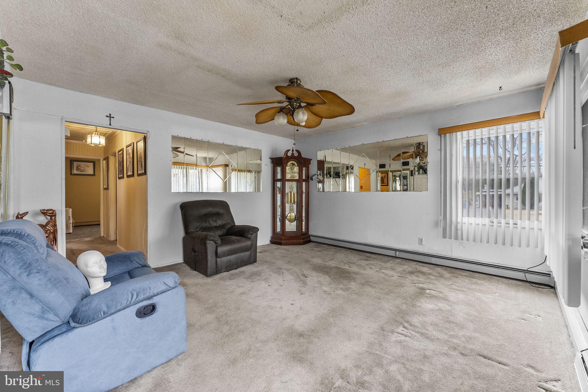 2 Dorset Drive Ewing, NJ 08618 - Photo 2 of 40 a living room with furniture a ceiling fan and a window