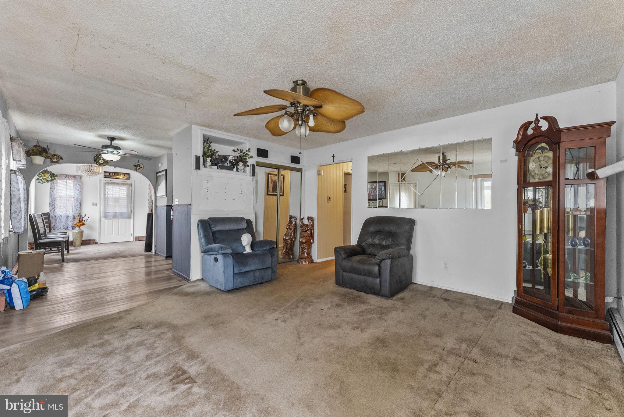 2 Dorset Drive Ewing, NJ 08618 - Photo 10 of 40 a living room with furniture and a chandelier