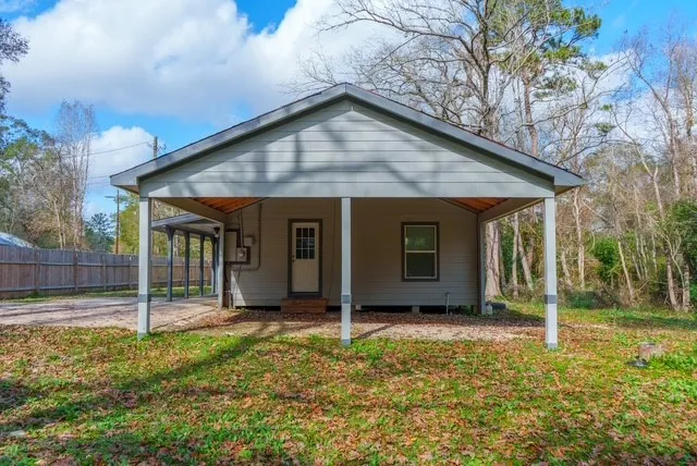 a backyard of a house with seating space