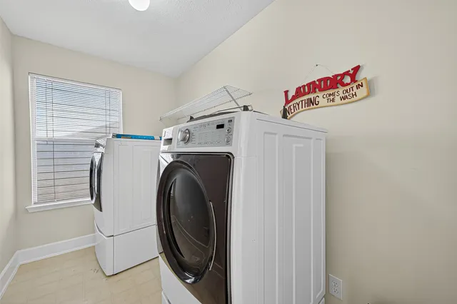 a utility room with dryer and washer