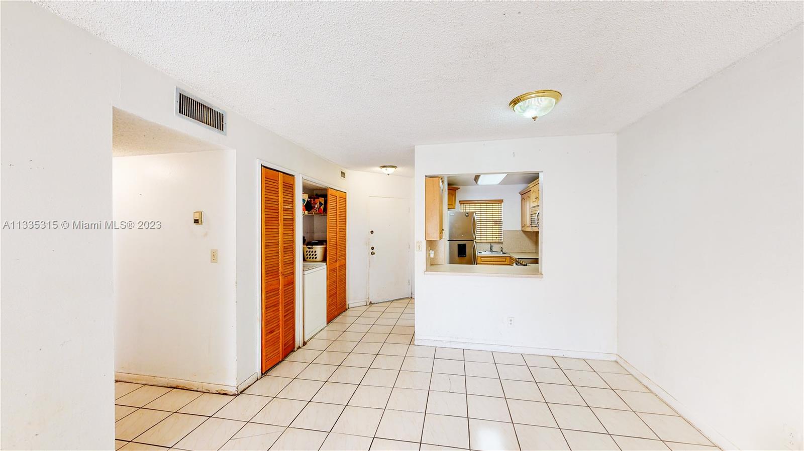 1750 West 46th Street, Unit 312 Hialeah, FL 33012 - Photo 13 of 41 a view of a hallway to rooms