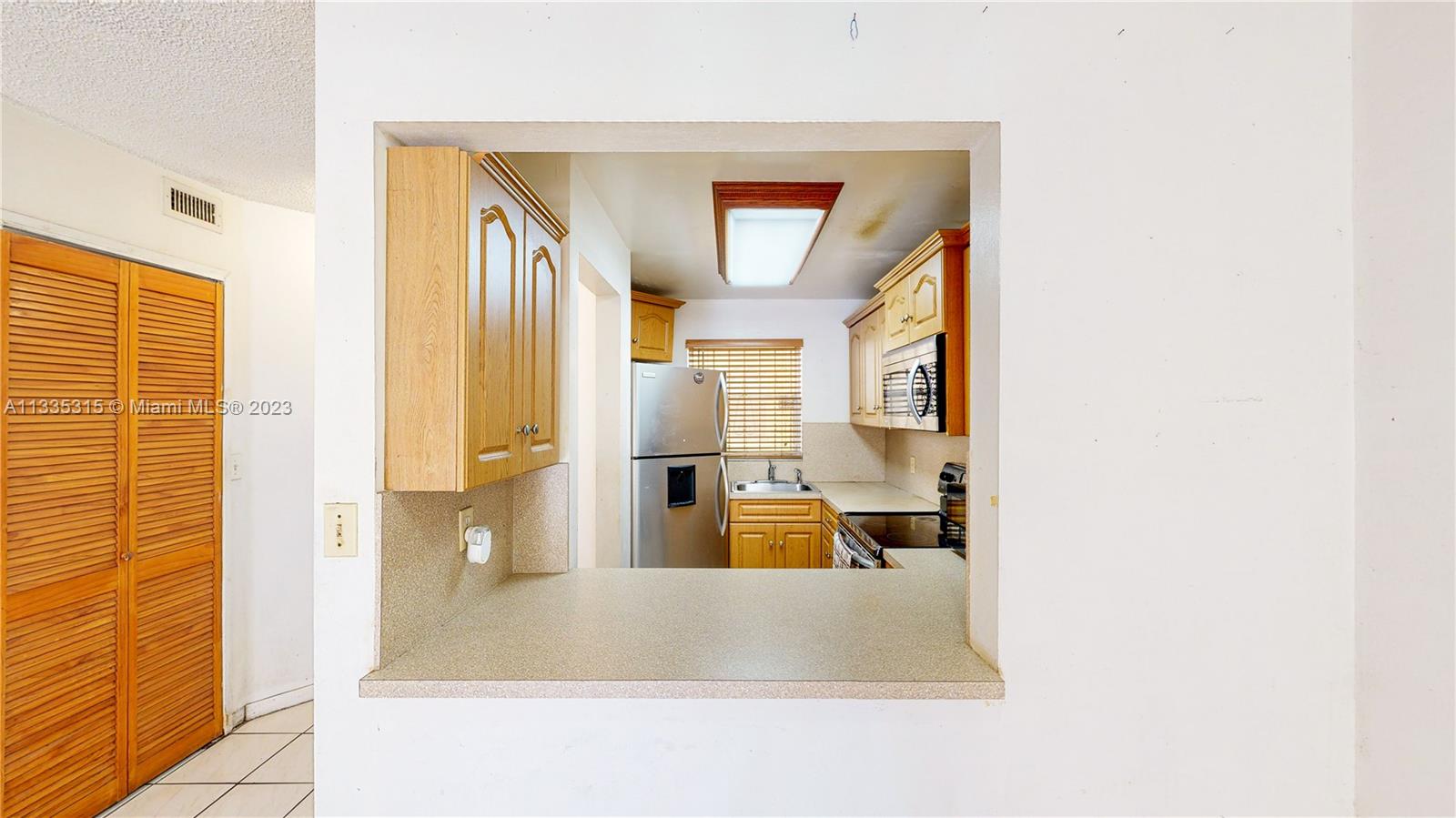 1750 West 46th Street, Unit 312 Hialeah, FL 33012 - Photo 14 of 41 a large bathroom with a tub sink and mirror