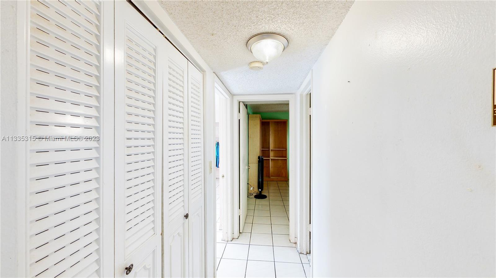 1750 West 46th Street, Unit 312 Hialeah, FL 33012 - Photo 16 of 41 a view of a hallway with window