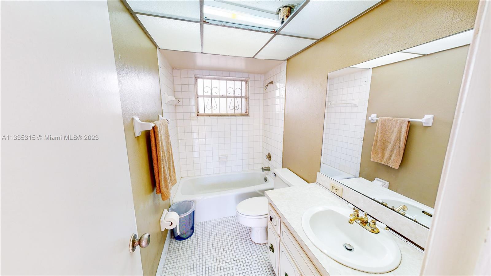 1750 West 46th Street, Unit 312 Hialeah, FL 33012 - Photo 17 of 41 a bathroom with a granite countertop sink and a mirror