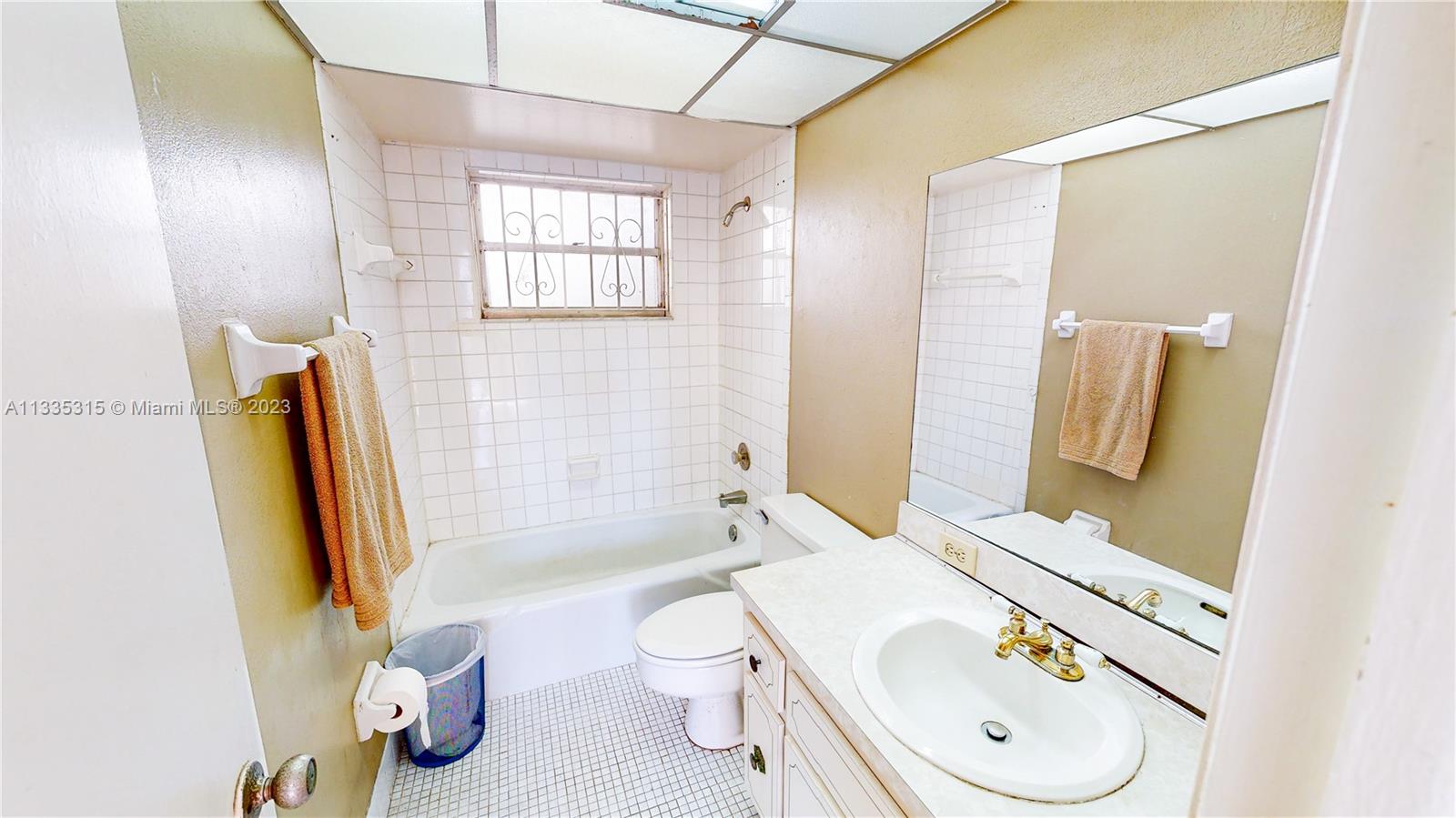 1750 West 46th Street, Unit 312 Hialeah, FL 33012 - Photo 18 of 41 a bathroom with a sink toilet and shower