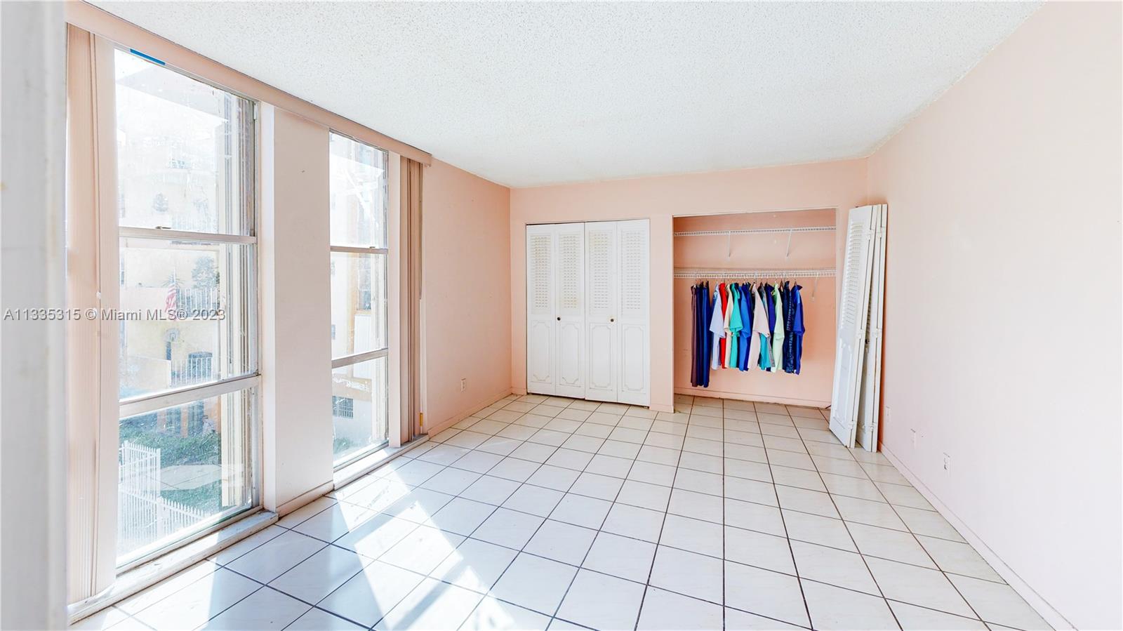 1750 West 46th Street, Unit 312 Hialeah, FL 33012 - Photo 21 of 41 a view of an empty room and window