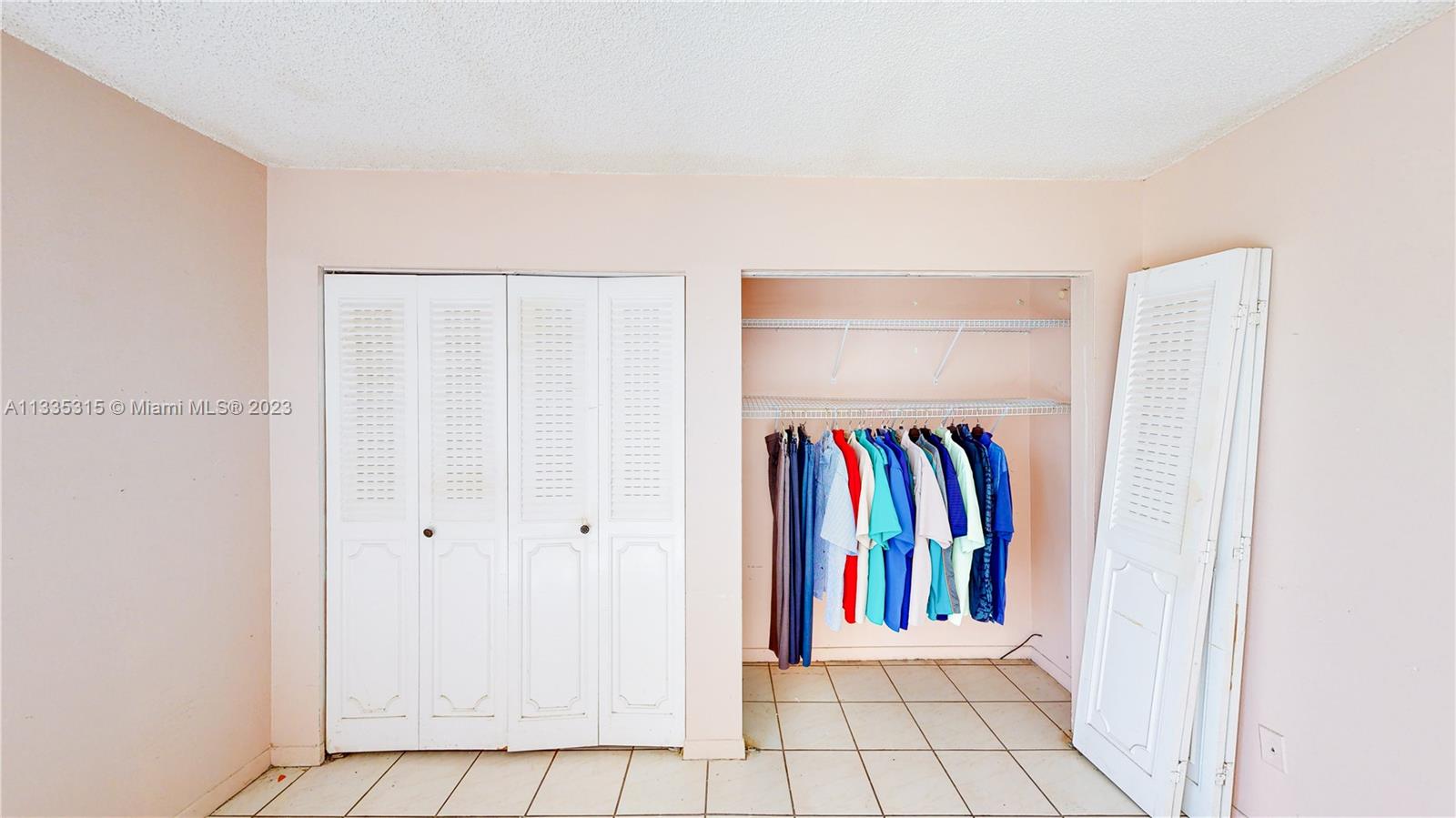 1750 West 46th Street, Unit 312 Hialeah, FL 33012 - Photo 22 of 41 a view of a room with air conditioner and a window