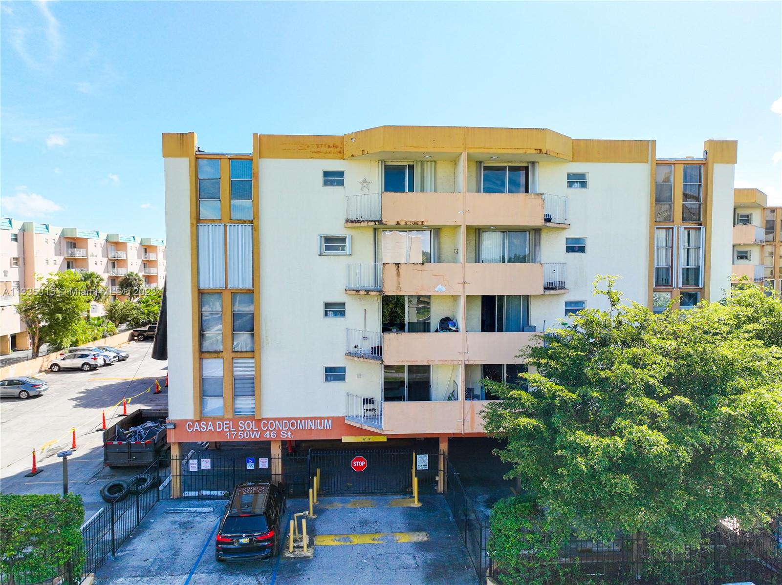 1750 West 46th Street, Unit 312 Hialeah, FL 33012 - Photo 32 of 41 a front view of a building with porch