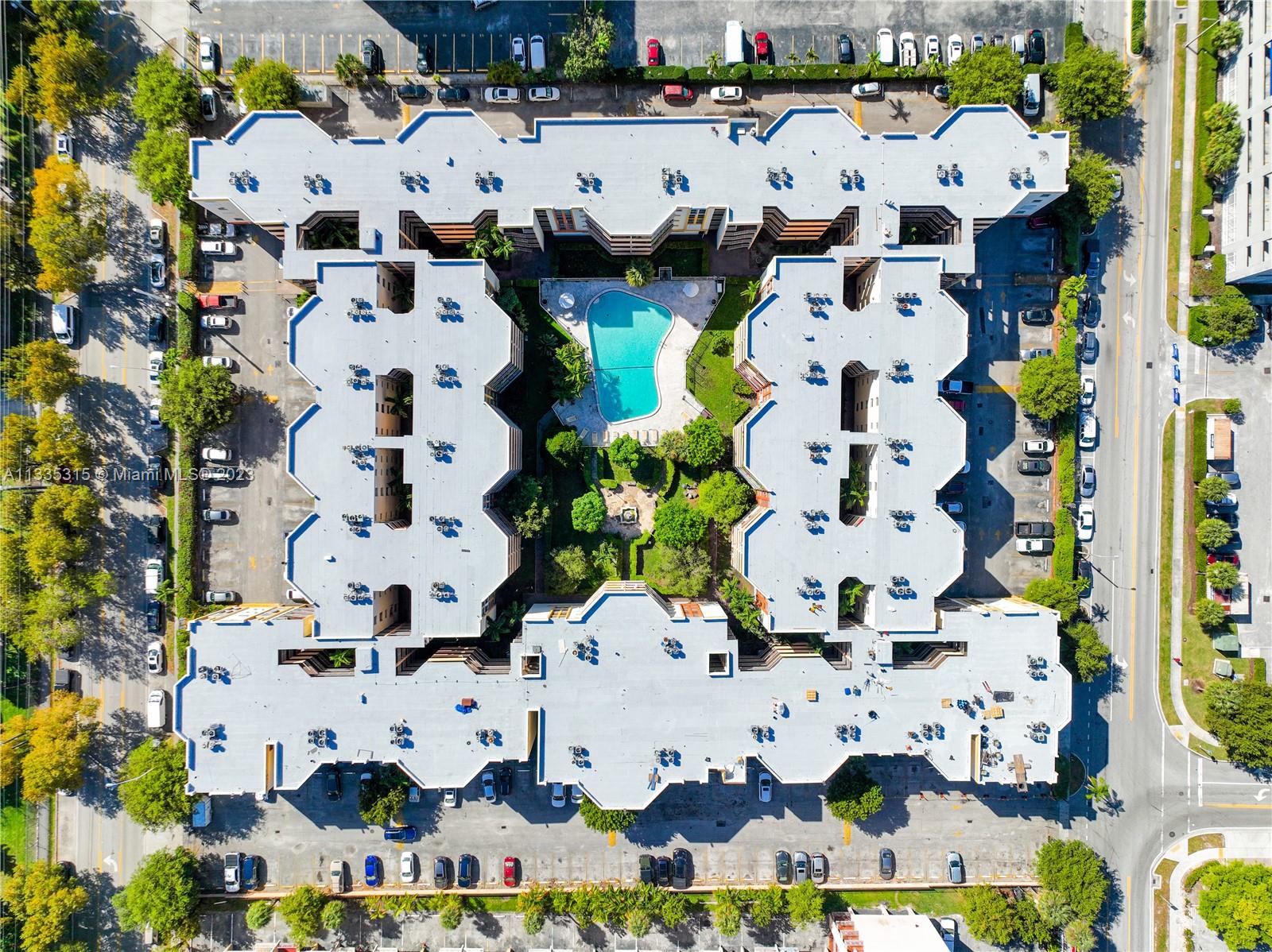 1750 West 46th Street, Unit 312 Hialeah, FL 33012 - Photo 38 of 41 an aerial view of residential houses with outdoor space