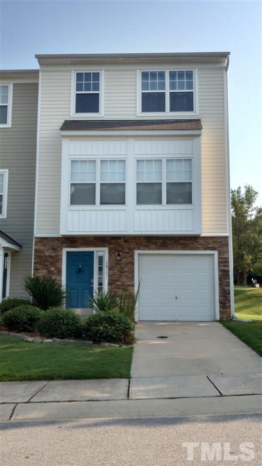 4911 Midstone Lane Raleigh, NC 27610 - Photo 1 of 28 a view of a building with a yard