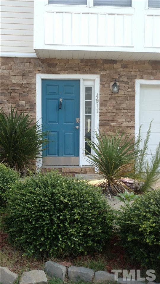 4911 Midstone Lane Raleigh, NC 27610 - Photo 2 of 28 a front view of a house with a yard