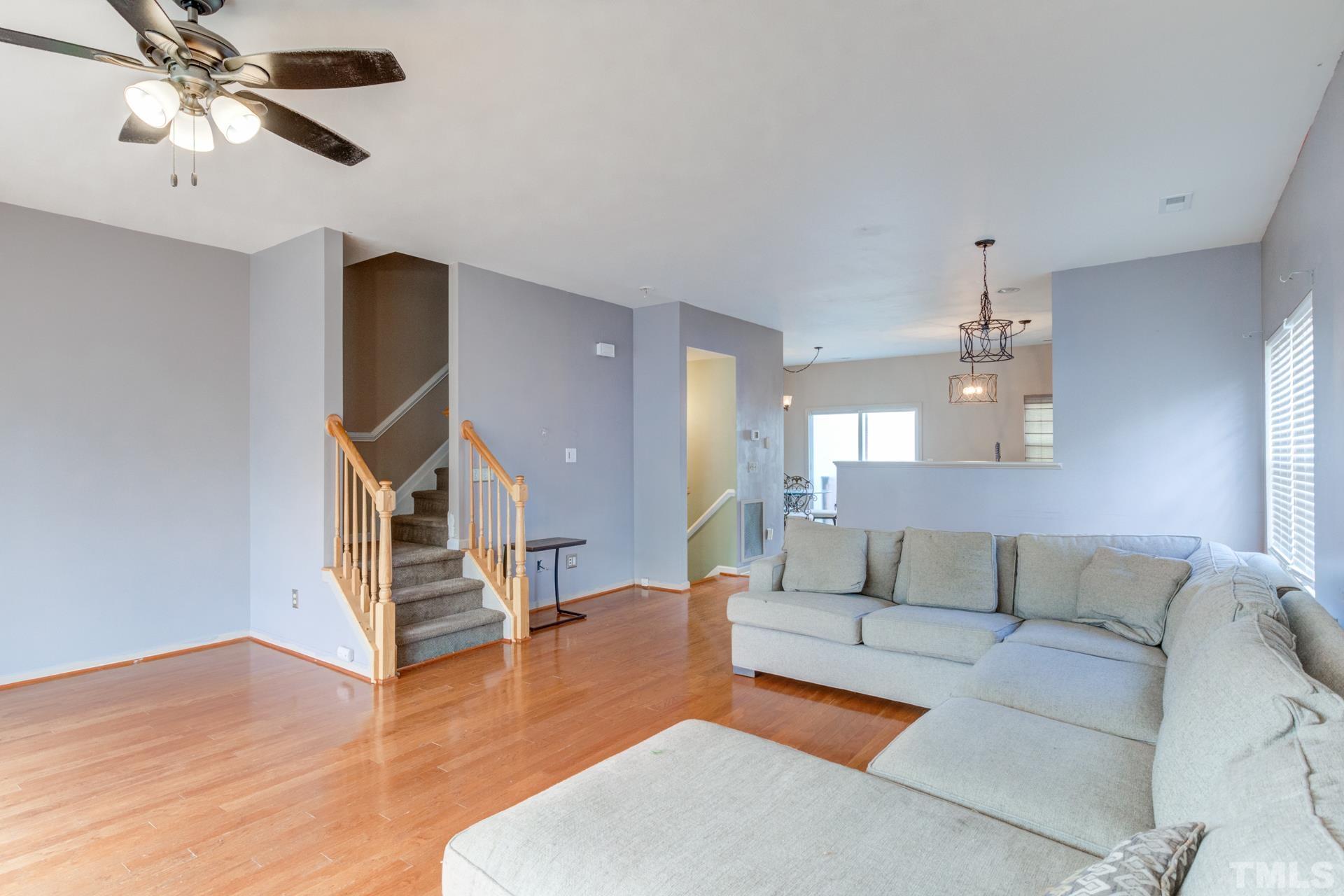 4911 Midstone Lane Raleigh, NC 27610 - Photo 12 of 28 a living room with furniture and a wooden floor