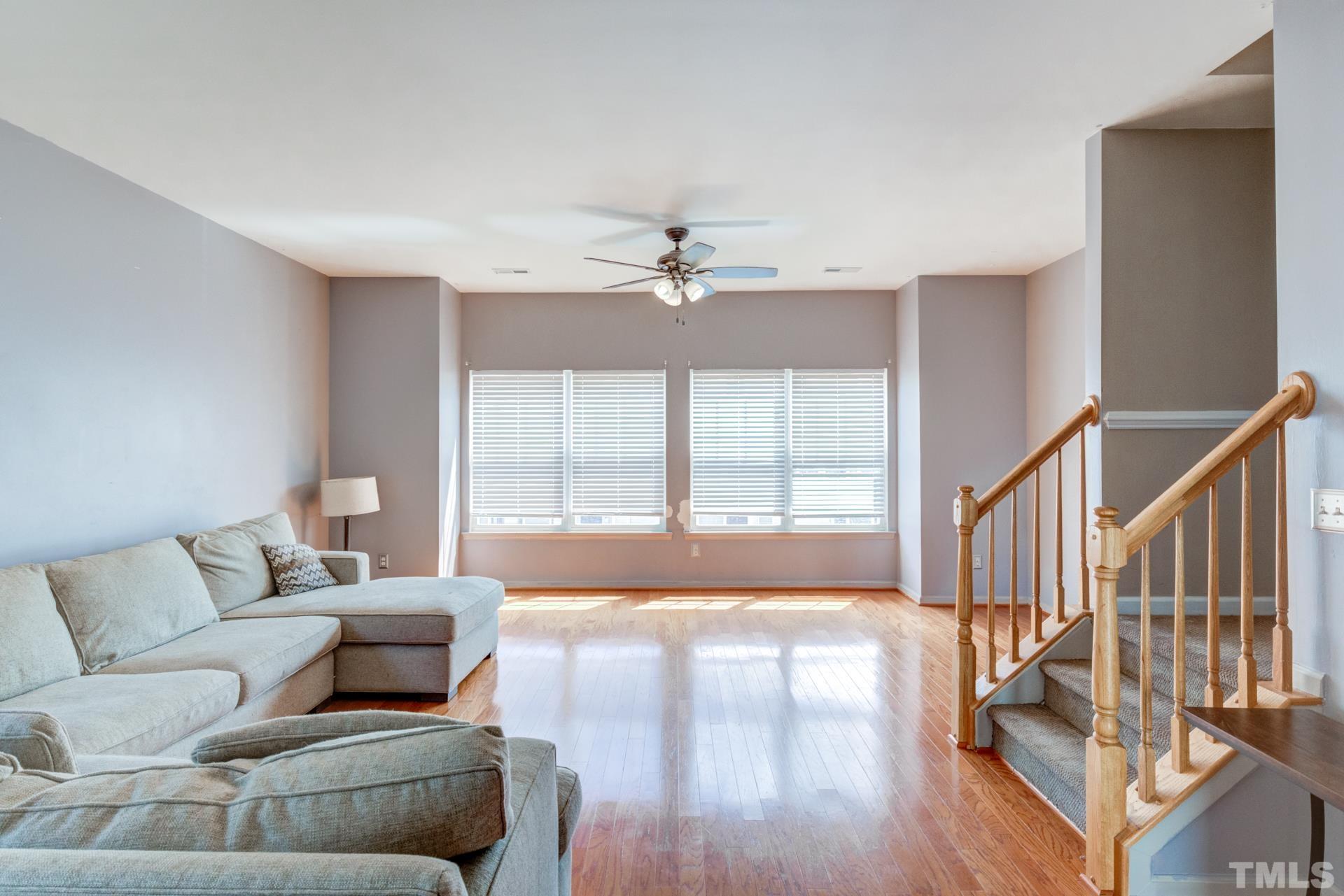 4911 Midstone Lane Raleigh, NC 27610 - Photo 13 of 28 a living room with furniture and a large window