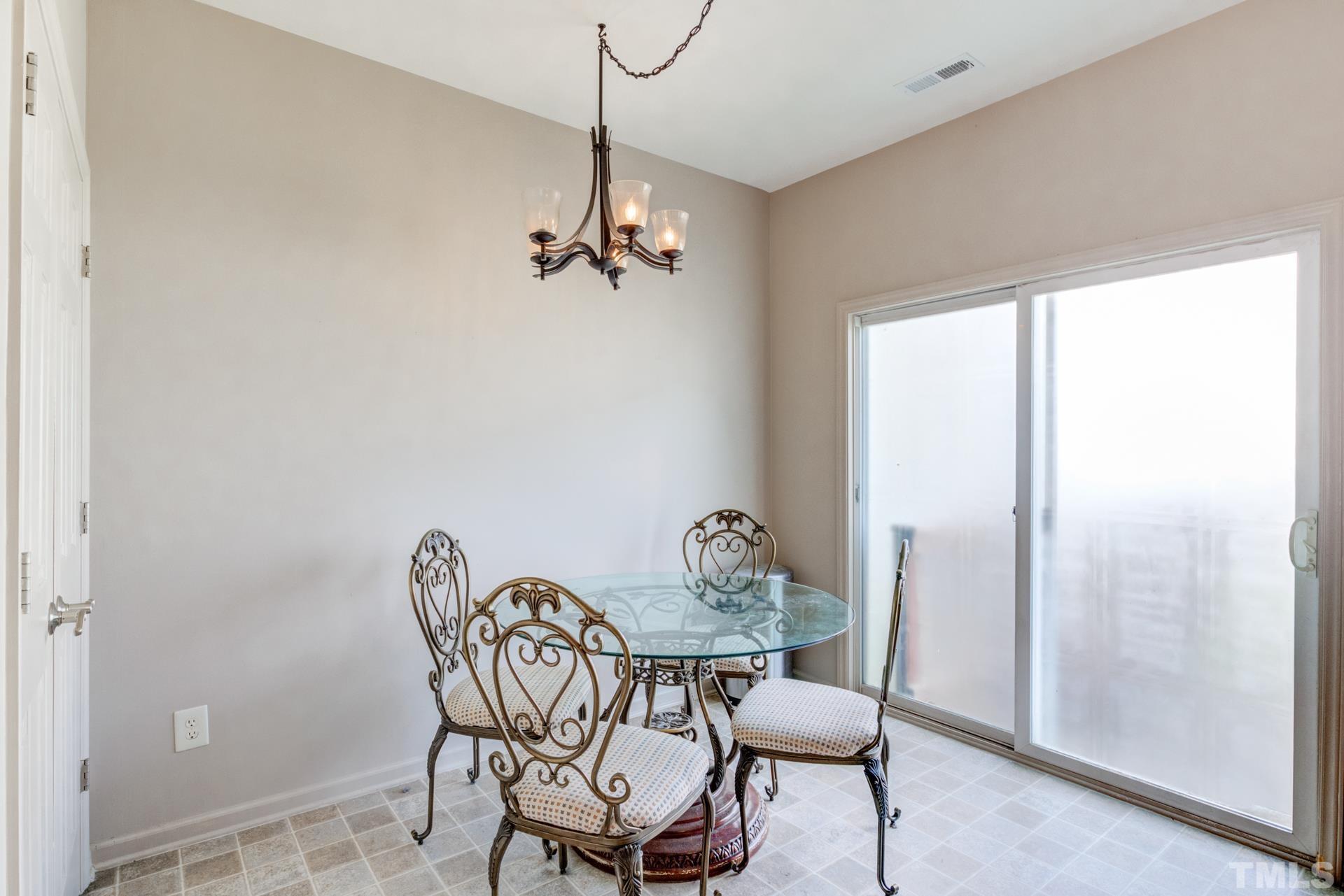 4911 Midstone Lane Raleigh, NC 27610 - Photo 17 of 28 a view of a dining room with furniture window and outside view