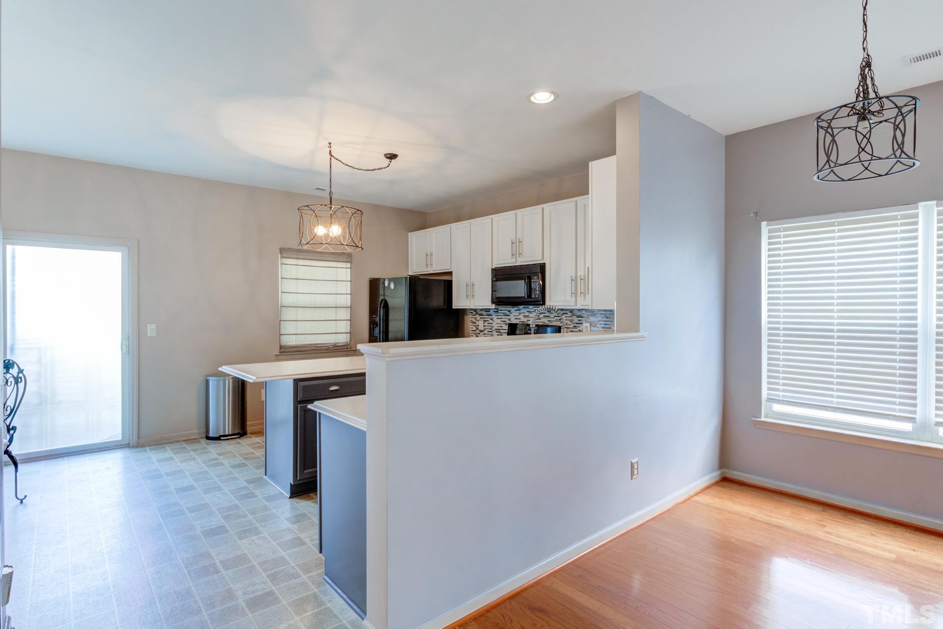 4911 Midstone Lane Raleigh, NC 27610 - Photo 10 of 28 a view of a kitchen with microwave and cabinets