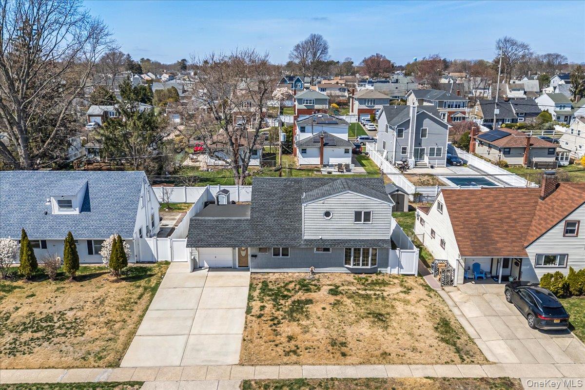 an aerial view of a house with a swimming pool