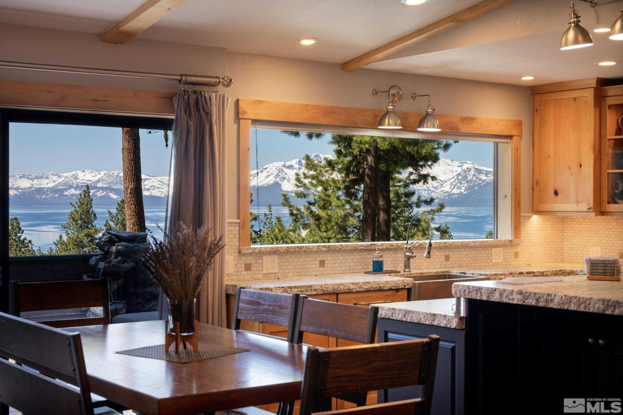a living room with granite countertop furniture a table and chairs